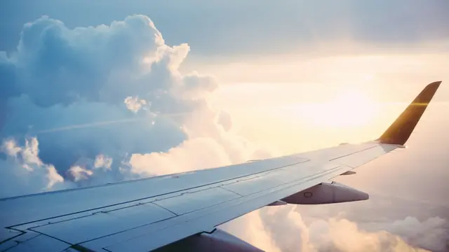 Aeroplane wing above the clouds