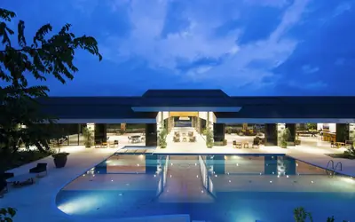 Resort pool lit up at night