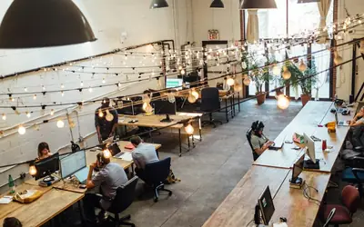 Coworking space with people working at shared desks