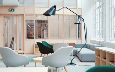 Bright office lounge with desks
