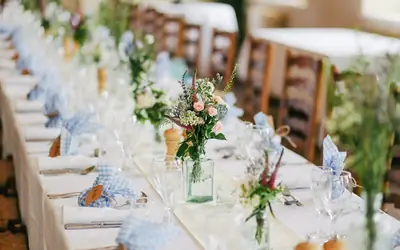 Outdoor wedding reception table with flowers