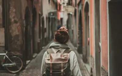 Traveller with a backpack in a narrow lane