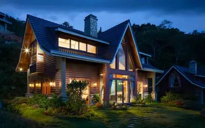 Family house lit up at dusk